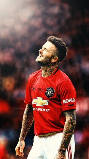 David Beckham During A Match In Old Trafford While Playing For Manchester United Wallpaper