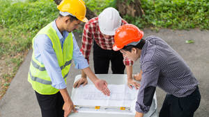 Dedicated Construction Worker Engaged In Building Project Wallpaper