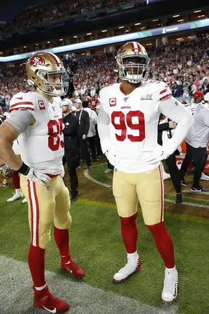 Deforest Buckner And George Kittle - Power Players Of Nfl Wallpaper