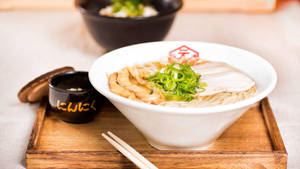 Delectable Hakata Ramen Served In A White Dining Ware Wallpaper