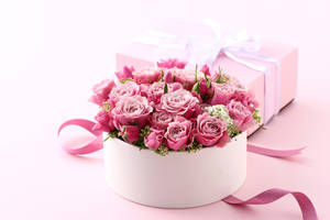 Delicate Light Pink Flowers Arranged In A Box Wallpaper