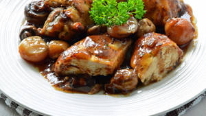 Delicious Coq Au Vin Adorned With Fresh Parsley Wallpaper