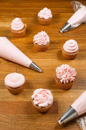 Delicious Cupcakes Ready For Frosting Wallpaper