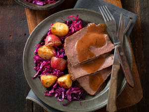 Delicious Sauerbraten With Potatoes And Red Cabbage Wallpaper