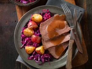 Delicious Sauerbraten With Potatoes And Red Cabbage Wallpaper