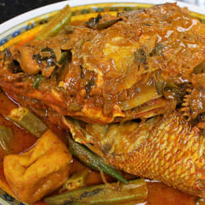 Delight In The Flavors With Fish Head Curry, A Signature Malaysian Dish Wallpaper