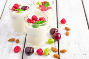 Delightful Mix Of Yogurt With Berries And Almonds Wallpaper