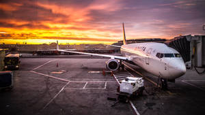 Delta Airlines Parked Plane At Dusk Wallpaper