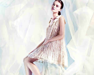 Delta Goodrem Behind The Piano, Expressing Her Passion For Music. Wallpaper