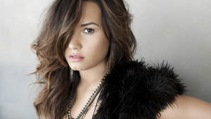 Demi Lovato In Furry Dress Wallpaper