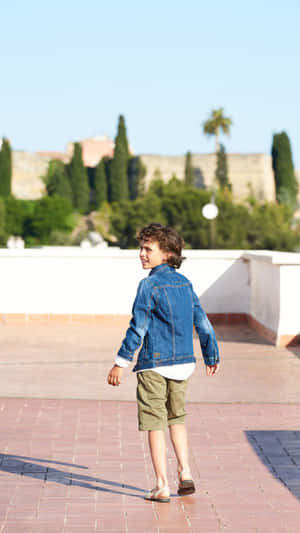 Denim Stylish Boy On Rooftop Wallpaper