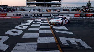 Denny Hamlin At The Finish Line Wallpaper