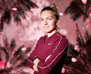 Determined And Focused - Simona Halep With Arms Crossed Wallpaper