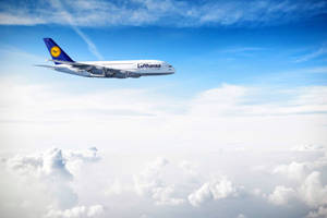 Deutsche Lufthansa Plane Isolated Above The Sky Wallpaper