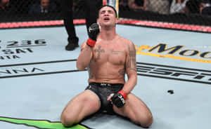 Diego Sanchez Kneeling In The Cage Wallpaper