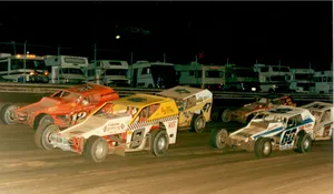 Dirt Car Racing Down A Country Road Wallpaper