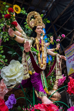 Divine Vaishno Devi On A Lotus Flower Wallpaper