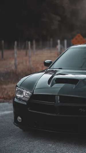Dodge Challenger With Black Cross Emblem Wallpaper