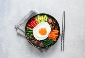 Dolsot Bibimbap On A Stone Counter Wallpaper
