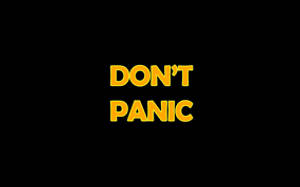 Don’t Panic Yellow Black Background Wallpaper