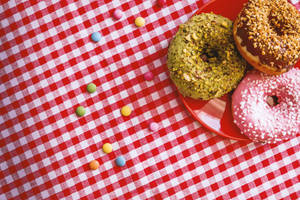 Donuts On Gingham Cloth Wallpaper
