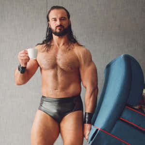 Drew Mcintyre Wrestler With Coffee Wallpaper