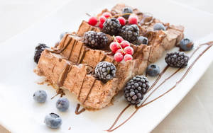 Dried Blueberries Plums And Mulberry Fruits On Waffle Wallpaper