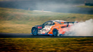 Drifting Orange Car Wallpaper