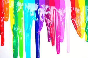 Dripping Rainbow Paint On A Colorful Background Wallpaper