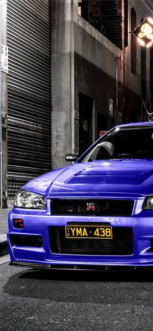 Driving A New Level Of Speed And Style With The Nissan Skyline Iphone. Wallpaper