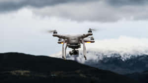 Drone_ Flight_ Over_ Mountainous_ Terrain Wallpaper