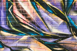 Dynamic Graffiti Illuminated By Reflected Lights Wallpaper