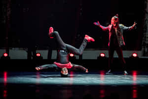 Dynamic Hip Hop Dance Performance Wallpaper