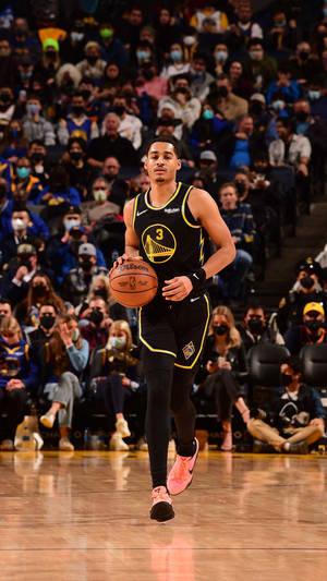 Dynamic Shot Of Nba Star, Jordan Poole In Action Wallpaper