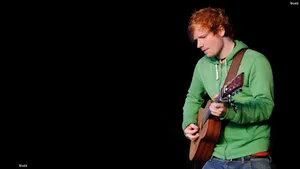 Ed Sheeran Wearing A Green Jacket Wallpaper