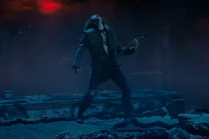 Eddie Munson Playing The Guitar In Stranger Things Wallpaper