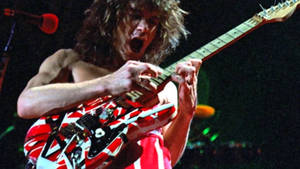 Eddie Van Halen Close-up Guitar Strum Wallpaper