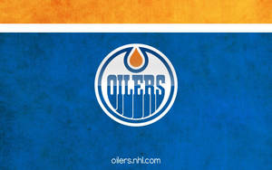 Edmonton Oilers In Action During A High Stakes Hockey Game Wallpaper