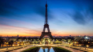 Eiffel Tower With Yellow Lights Around Wallpaper