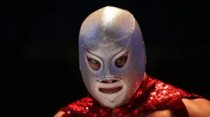 El Santo Mask On His Son Wallpaper