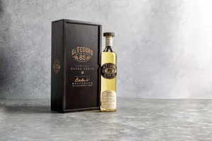 El Tesoro Tequila Bottle And Black Box Wallpaper