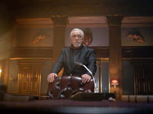 Elderly Man Standing Behind Leather Chair Wallpaper