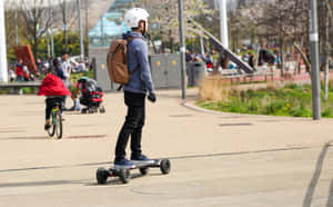 Electric Skateboard Riderin Park Wallpaper