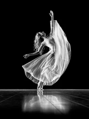 Elegant Ballet Dancer In Action Wallpaper