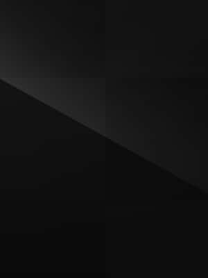 Elegant Black Ipad Showcasing A Sophisticated Black And Gray Checkered Pattern Wallpaper Wallpaper