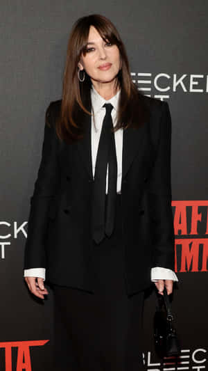 Elegant Celebrityin Black Suit Wallpaper