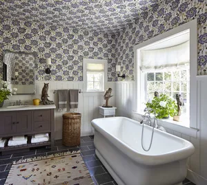 Elegant Lavender Bathtub Amidst Floral Beauty Wallpaper