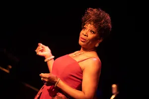 Elegant Performerin Red Dress Wallpaper