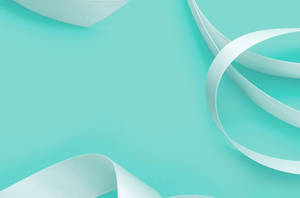 Elegant White Ribbon On Tiffany Blue Backdrop Wallpaper