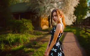 Elegant Woman Springtime Garden Wallpaper